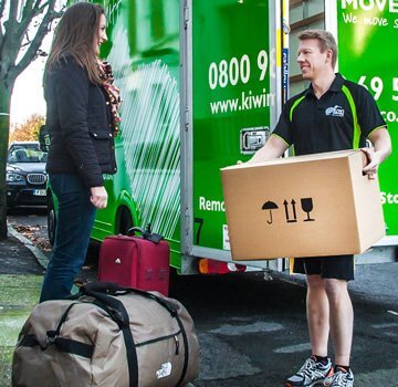 Kiwi Movers removal man unloading van