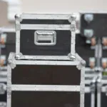 Stacked flight cases in secure film production storage between shoots in Londo